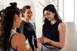© Studio Marmellata/Stocksy - Athletic women talking to each other in gym