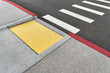 © Andriy Bezuglov/Stocksy - Closeup view at colorful crosswalk with tactile paving
