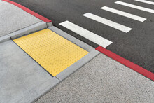 Closeup View At Colorful Crosswalk With Tactile Paving