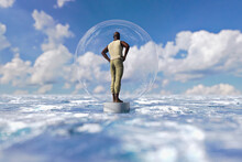 African Man Standing On Plinth At Sea Inside Bubble 
