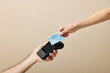© Martí Sans/Stocksy - Clients paying to seller with credit card