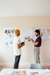 © BONNINSTUDIO/Stocksy - Male colleagues discussing design project