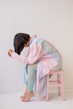 Anonymous Depressed Woman Sitting On Stool 