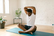 © STUDIO TAURUS/Stocksy - Strong male practicing yoga indoors.