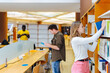 © VICTOR TORRES/Stocksy - University students doing homework in the library