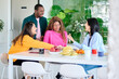 © Guille Faingold/Stocksy - coworker, lunch, talk, smile, canteen,