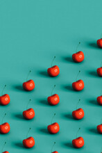 Red Cherries On Blue Background With Copy Space