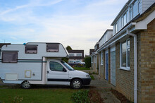 Suburban Street With Houses And Campervan