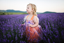 Portrait Of Cute Child In Purple Lavender Field