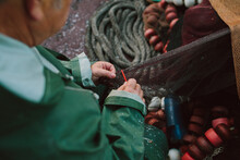 Fisherman Repairing The Nets For Fishing.