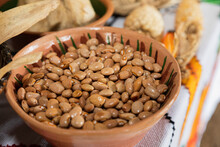 Close Up Of A Clay Bowl Full Of Uncooked Beans 