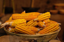 Yellow Corn Cobs In A Basket In A Traditional Mexican Kitchen