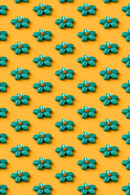 Isometric Pattern Of Many Blue Flowers On Yellow Background