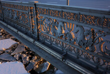 Decorations On A Bridge Over A Frozen River
