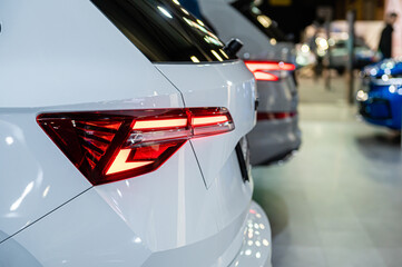 Wall Mural - closeup of a red led taillight on a modern car, detail on the rear light of a car