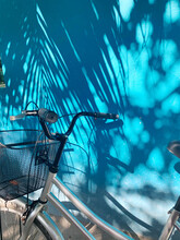 Summer, Bicycle Near Blue Wall With Shadow Of Palm Tree