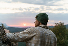Back View Portrait Of Man Exploring Nature At Sunset