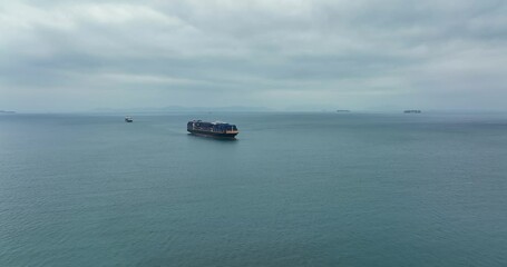 Wall Mural - Hong Kong Drone fly on cargo ship cross the sea