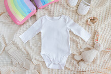White Baby Long Sleeve Bodysuit In Scandinavian Interior With Minimalistic Decoration, Mockup.