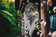 Handmade Dream Catcher With Ornaments In Natural Green Background