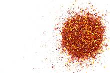 Pile Of Red Pepper Flakes On A White Background
