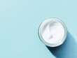 Face cream moisturiser jar as product sample on mint background, beauty and skincare, cosmetic science
