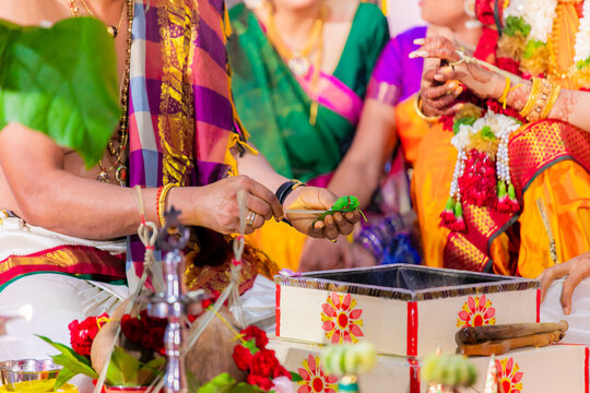 Indian Hindu wedding ceremony and rituals bride and groom's hands close up