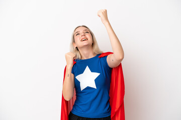 Wall Mural - Young caucasian woman isolated on white background in superhero costume and celebrating a victory