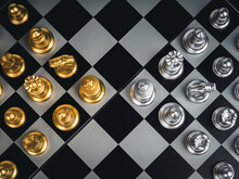 Top View Of Set Of Golden And Silver Chess Pieces Element, King, Queen Rook, Bishop, Knight, Pawn Standing On Chessboard, Close-up. Competition, Game, War, Emulation And Planning Concept.