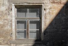 Vintage Old Window In The Old Wall With Sandstone Facde, 
Cracked And Damaged Wall, No Person