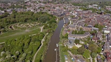 Wall Mural - Aerial footage along the River Ouse as it enters the town of Lewes in East Sussex in Southern England.