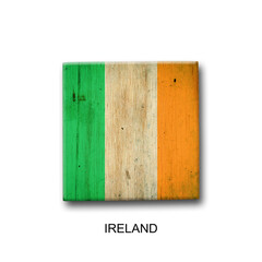 Wall Mural - Ireland flag on a wooden block. Isolated on white background. Signs and symbols.