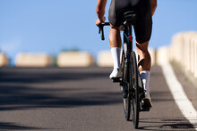 Male Cyclist Riding Racing Bicycle, Man Cycling On Countryside Summer Road. Training For Triathlon Or Cycling Competition