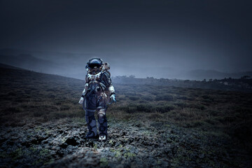 Wall Mural - astronaut walking on an unexplored planet