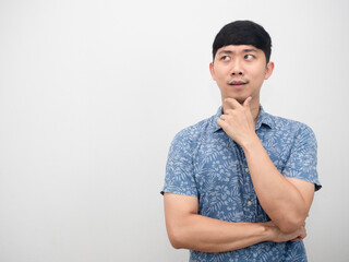 Portrait asian man blue shirt gesture thinking and looking at copy space