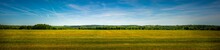 Panorama Shot Of An Agricultural Field In The Sloping Hills Of The Condroz In Wallonia, Belgium.