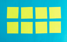 Yellow Blank Note Paper On Blue Paper Background