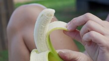 woman eats a banana