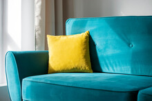 Bright Yellow Pillow On Blue, Turquoise Sofa Or Couch, Interior Of The Comfortable Residential Room