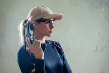 A Woman Target Practicing With A Handgun For Self Defense