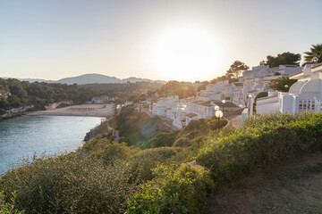 Wall Mural - sunset at a beach with houses near porto christo, mallorca, spain