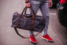 Cropped Photo Of A Well-dressed Man With A Duffel Bag