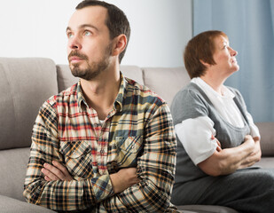 Wall Mural - Elderly mother and son quarrel with each other and find out relationship