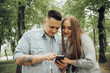 © Eugene - a couple in love is looking for a suitable route in the maps on the phone
