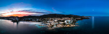 Spain, Balearic Islands, Santa Ponsa, Helicopter Panorama Of Coastal Town At Dusk