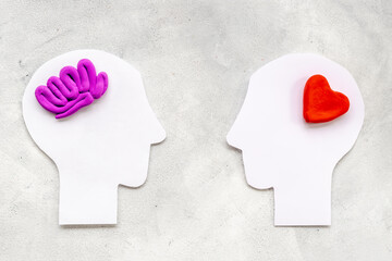 Wall Mural - Brain and heart. Logic and emotion communication concept with two paper heads