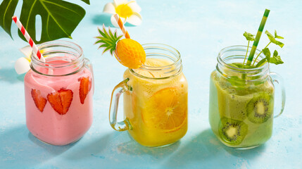 Wall Mural - Healthy fresh fruit and berry smoothies in glass jars. Summer cold drinks