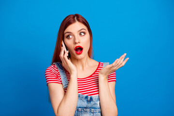 Poster - Photo of pretty young girl speak communicate telephone isolated on blue color background