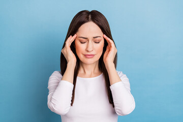 Sticker - Photo of unhappy young brunette lady headache wear white pullover isolated on blue color background