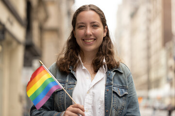 Sticker - Caucasian LGBTQ woman on a city street portrait smiling happy